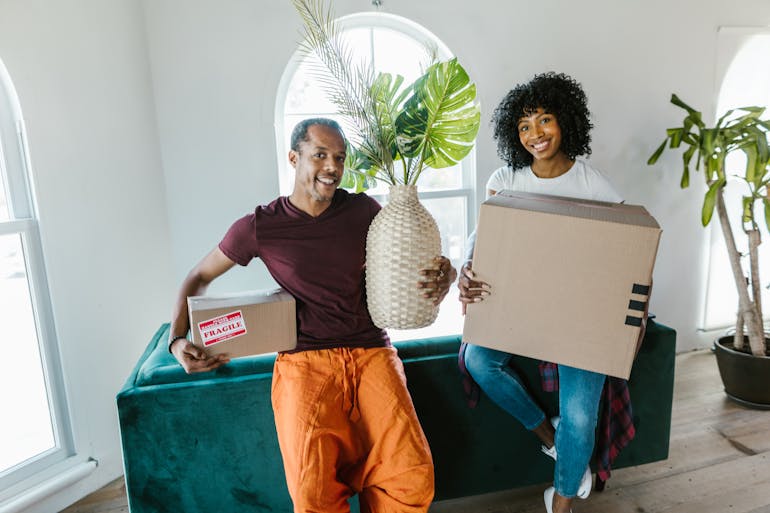 People holding moving boxes