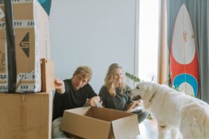 couple packing for relocation after reading tips for finding pet-friendly real estate