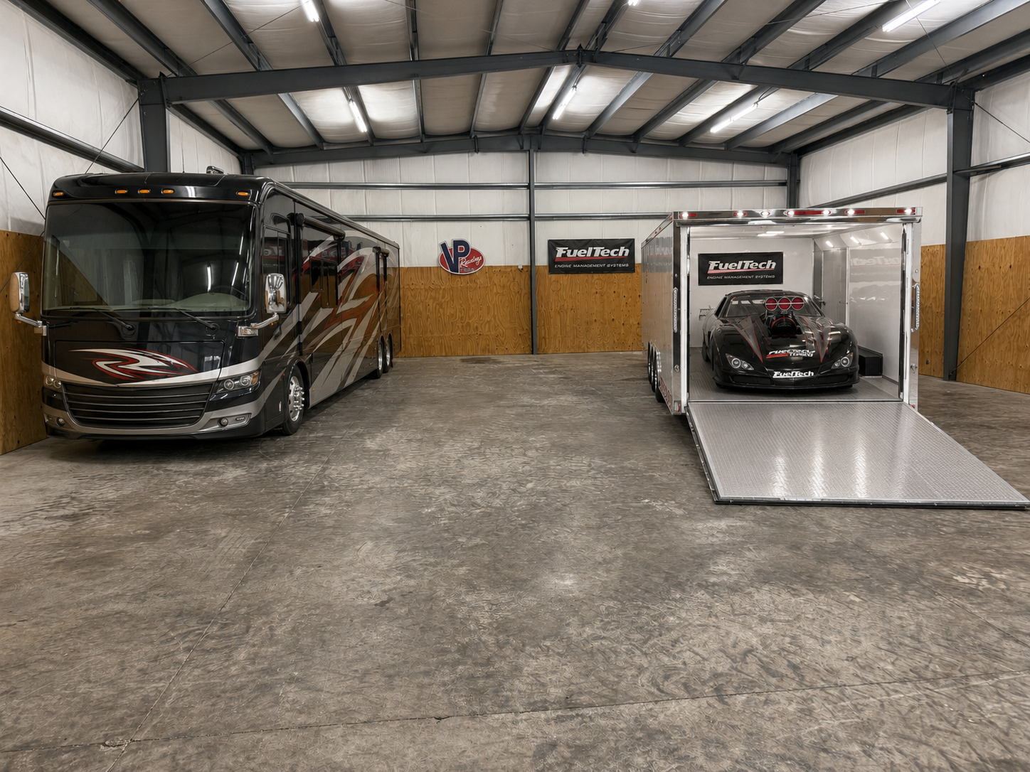 Large detached metal workshop with tall roll-up doors